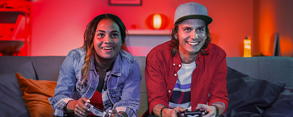 Older teens gaming on the couch