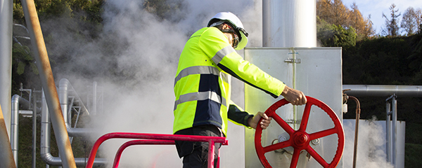 Man turning a valve