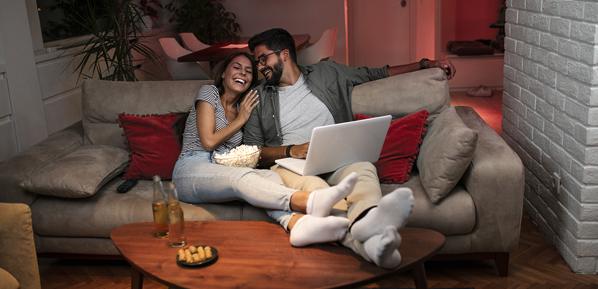 Lounge couple enjoying tv | CB | 1200x580